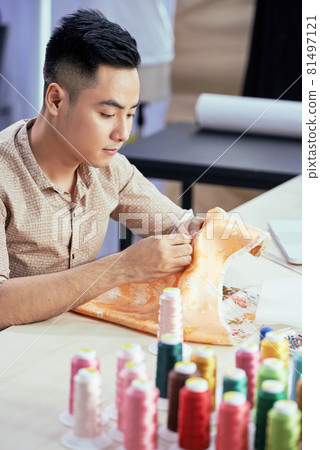Tailor Working with Expensive Silk Fabric Tailor Working with Expensive Silk Fabric 81497121
