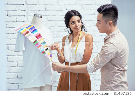 Fashion Designers Choosing Fabric for T-shirts 81497125