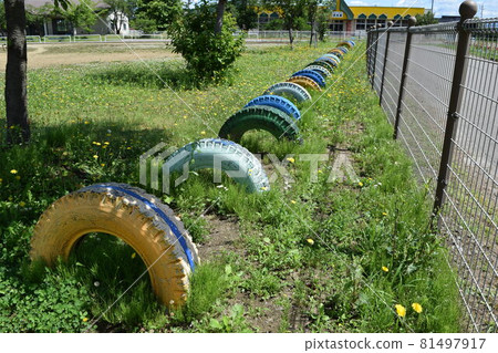 Playground equipment installed in the elementary school yard 81497917