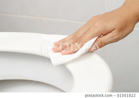 woman using tissue paper clean the toilet in the bathroom at home. woman using tissue paper clean the toilet in the bathroom at home. 81501822