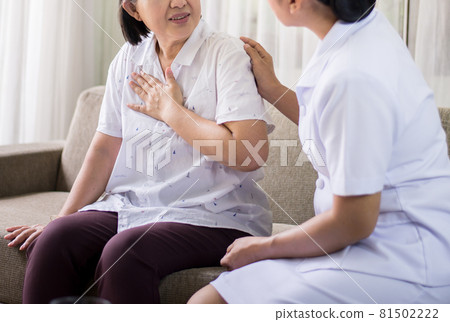 Elderly asian woman having chest pain suffering from heart attack,Nurse take care and support 81502222