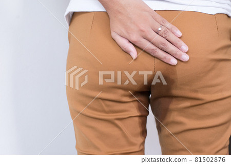 Hands woman holding her bottoms,Female need to pee,Urinary stain incontinence,Copy space for text on white background 81502876