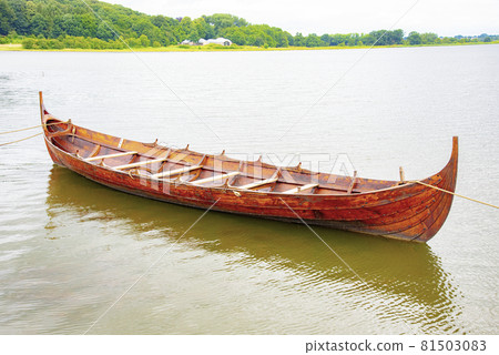 View of small viking boat karve by the river shore View of small viking boat karve by the river shore 81503083