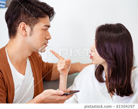 Asian young woman and Asian young man have differences in opinion discussion and are communicating. Asian young woman and Asian young man have differences in opinion discussion and are communicating. 81504297