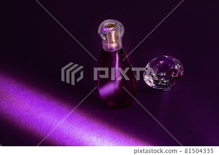 Perfume bottles studio shot on colored background with reflection Perfume bottles studio shot on colored background with reflection 81504335