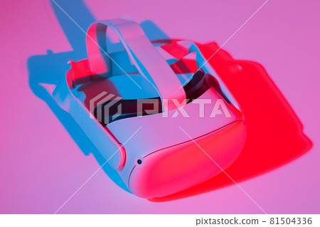 Virtual reality helmet on white background in neon light. VR technology concept. Virtual reality helmet on white background in neon light. VR technology concept. 81504336