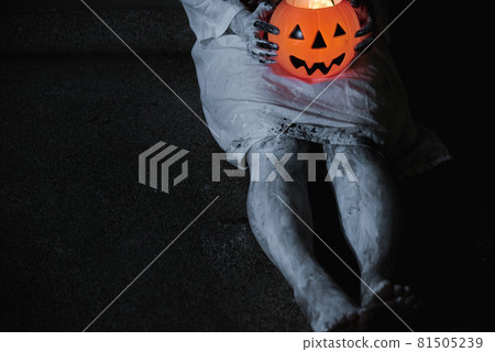 Woman ghost horror have hand holding her pumpkin, 81505239