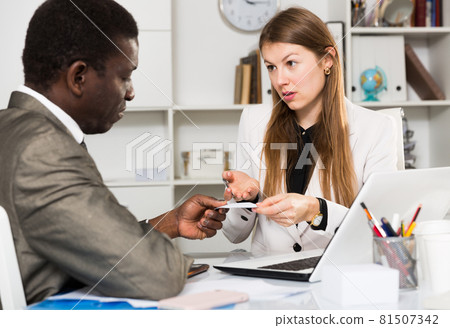 Two colleagues talking in office 81507342