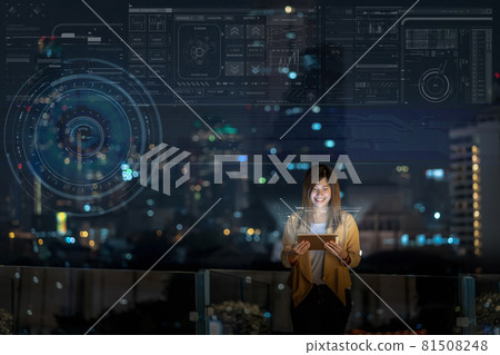 Asian businesswoman using tablet with smile action showing digital virtual screen over the cityscape background at night time, Business technology and innovation concept 81508248