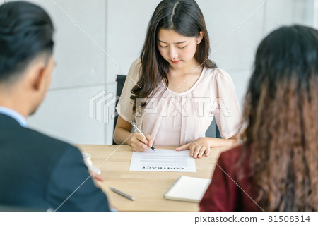 Young Asian woman signing the contract with two manager with positive motion in meeting room,Business Hiring new member , Job interview agreement, sign contract with manager concept Young Asian woman signing the contract with two manager with positive motion in meeting room,Business Hiring new member , Job interview agreement, sign contract with manager concept 81508314