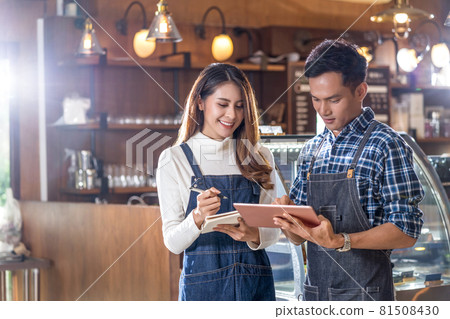 Asian Young Small business owner discussing and coaching job together with colleague in domestic coffee shop, entrepreneur and startup, using technology laptop and lecture, business partner concept Asian Young Small business owner discussing and coaching job together with colleague in domestic coffee shop, entrepreneur and startup, using technology laptop and lecture, business partner concept 81508430