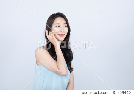 summer skin care, young Asian woman with cream on cheek. 81509440