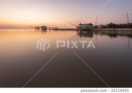 Panoramic view of fishing huts at sunrise Panoramic view of fishing huts at sunrise 81510403