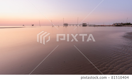 Landscape view of fishing huts at sunrise Landscape view of fishing huts at sunrise 81510404