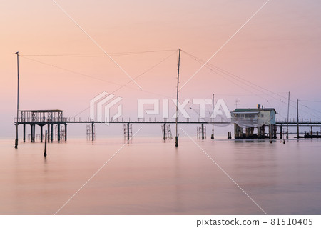 Minimalist view of fishing huts at sunrise Minimalist view of fishing huts at sunrise 81510405