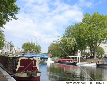 Water bus floating in a canal under the blue sky England 81510671