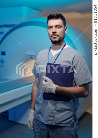 Contemporary young doctor in uniform holding medical document Contemporary young doctor in uniform holding medical document 81511054