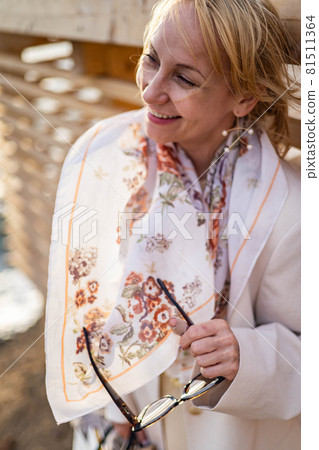 Laughing fashion woman relaxing having fun and positive emotion at luxury resort wooden embankment 81511364