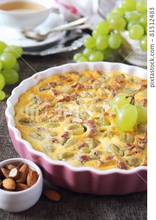 Green grape clafoutis with almonds and cup of tea Green grape clafoutis with almonds and cup of tea 81512483