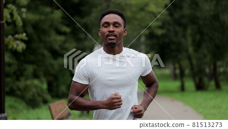 Man running in park on public green background. African american male runner run in park at morning. Health care concept. 81513273