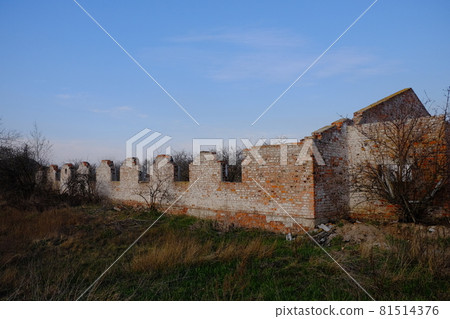 A ruined barn on an abandoned livestock farm. 81514376