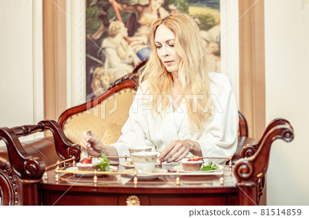 Beautiful young adult blond woman, On the table Beautiful young adult blond woman, On the table 81514859