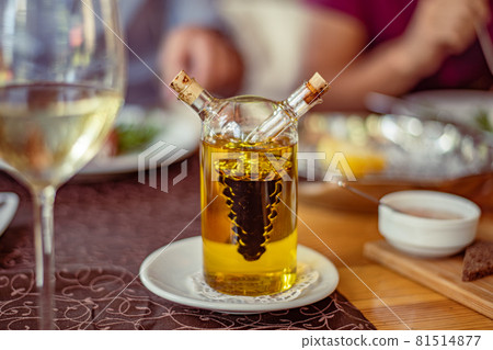 Glass on a high thin leg with white wine in a 81514877