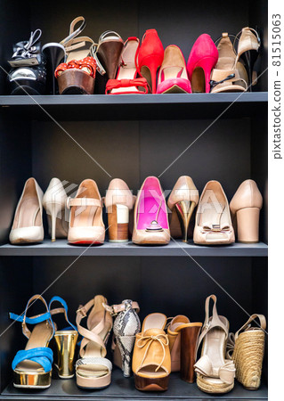 Gray closet shelves full of fashion female shoes on heels pair storage organization of cupboard Gray closet shelves full of fashion female shoes on heels pair storage organization of cupboard 81515063