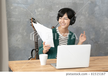 A woman enjoying music A woman enjoying music 81515167