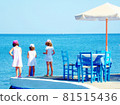 Three girls staring at the future swaying over the Aegean Sea from Santorini 81515436