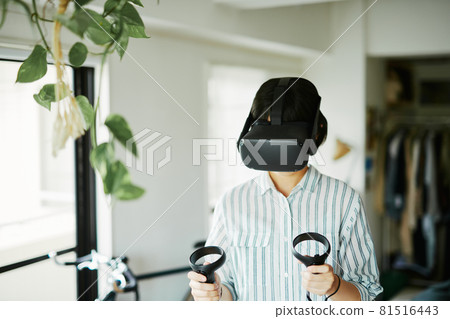 A woman enjoying VR indoors A woman enjoying VR indoors 81516443