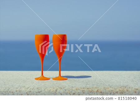 Champagne glasses by the blue sea Champagne glasses by the blue sea 81518040