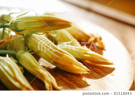 Fresh close up zucchini flowers at the kitchen Fresh close up zucchini flowers at the kitchen 81518043