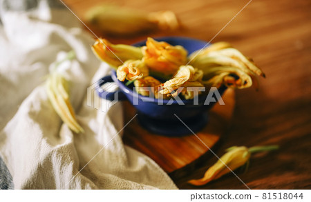 Fresh close up zucchini flowers at the kitchen Fresh close up zucchini flowers at the kitchen 81518044