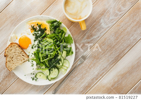 Healthy breakfast eggs with green salad and cup of coffee cappuccino Healthy breakfast eggs with green salad and cup of coffee cappuccino 81519227