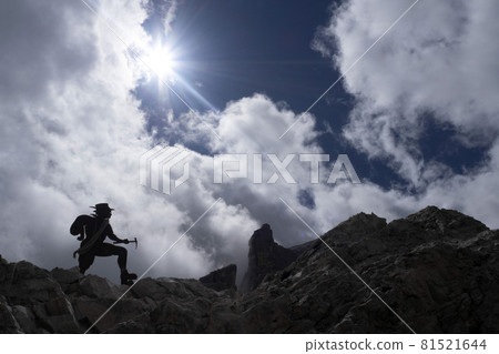 alpinist silhouette in tofane dolomites mountains panorama alpinist silhouette in tofane dolomites mountains panorama 81521644