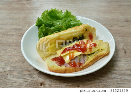 baked Danish bread stuffed slice pork bacon with mashed spinach and cheese dressing ketchup eat couple fresh lettuce vegetable salad on plate baked Danish bread stuffed slice pork bacon with mashed spinach and cheese dressing ketchup eat couple fresh lettuce vegetable salad on plate 81521859