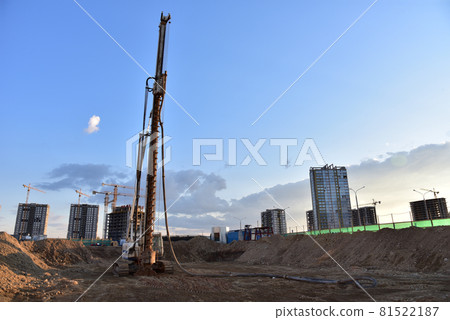 Excavator during excavation at construction site. Excavator during excavation at construction site. 81522187