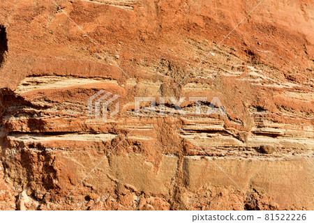 Rock texture during earthworks. Sand background and Earth's crust. 81522226