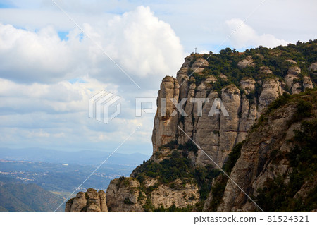 Montserrat is a mountain near Barcelona, in Catalonia. It is the site of a Benedictine abbey, Santa Maria de Montserrat, which hosts the Virgin of Montserrat sanctuary 81524321