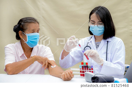 A doctor with a syringe And a sample of blood tube for analysis and test virus disease in the laboratory from elderly patients, This research is plasma biomedicine for diagnostic medical healthcare A doctor with a syringe And a sample of blood tube for analysis and test virus disease in the laboratory from elderly patients, This research is plasma biomedicine for diagnostic medical healthcare 81525468