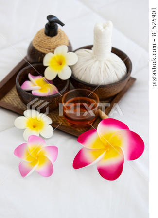 Set of spa treatments, natural oil, and plumeria flowers 81525901