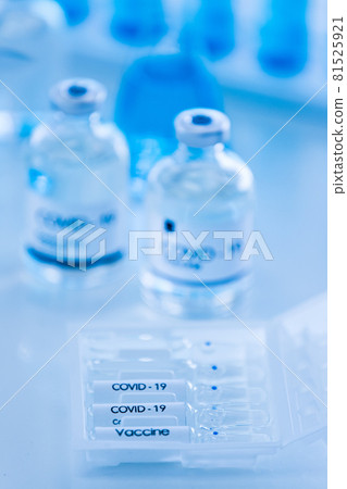 Bottle of COVOD-19 vaccine sample in a laboratory. Idea for researching and lab tests for coronavirus curing. 81525921