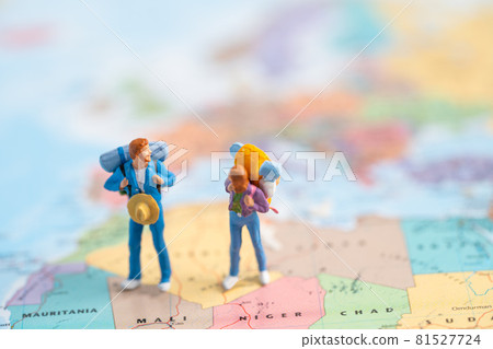 Bangkok, Thailand, July 30, 2021 Miniature people, Two backpacker enjoy to discovery journey travel at amazing on world map. 81527724