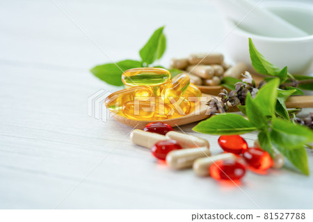 Alternative medicine herbal organic capsule with vitamin E omega 3 fish oil, mineral, drug with herbs leaf natural supplements for healthy good life. 81527788