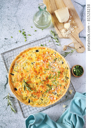 French cuisine: Zucchini and salmon quiche with parmesan cheese 81528238