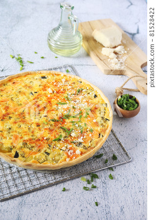 Zucchini and salmon quiche with parmesan cheese 81528422