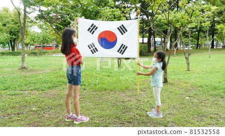 Two children holding the Taegeukgi Two children holding the Taegeukgi 81532558
