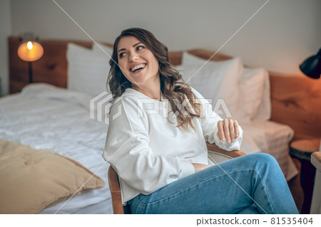 Pretty young long-haired woman in a white blouse 81535404