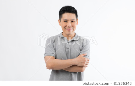 Portrait of Asian man with smile face poses with self-confidence folded arms looking to camera Portrait of Asian man with smile face poses with self-confidence folded arms looking to camera 81536343